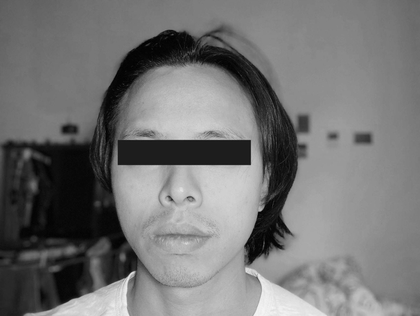 Das Bild zeigt Yun-Wen Liu mit einem schwarzen Balken vor den Augen.